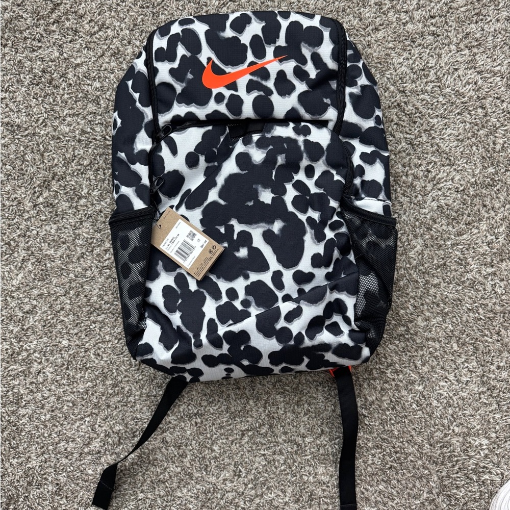 Nike Black and White Camouflage Backpack with Orange Swoosh